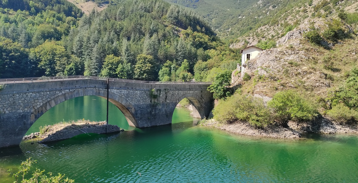 Bridge over lake with old bridge underneath