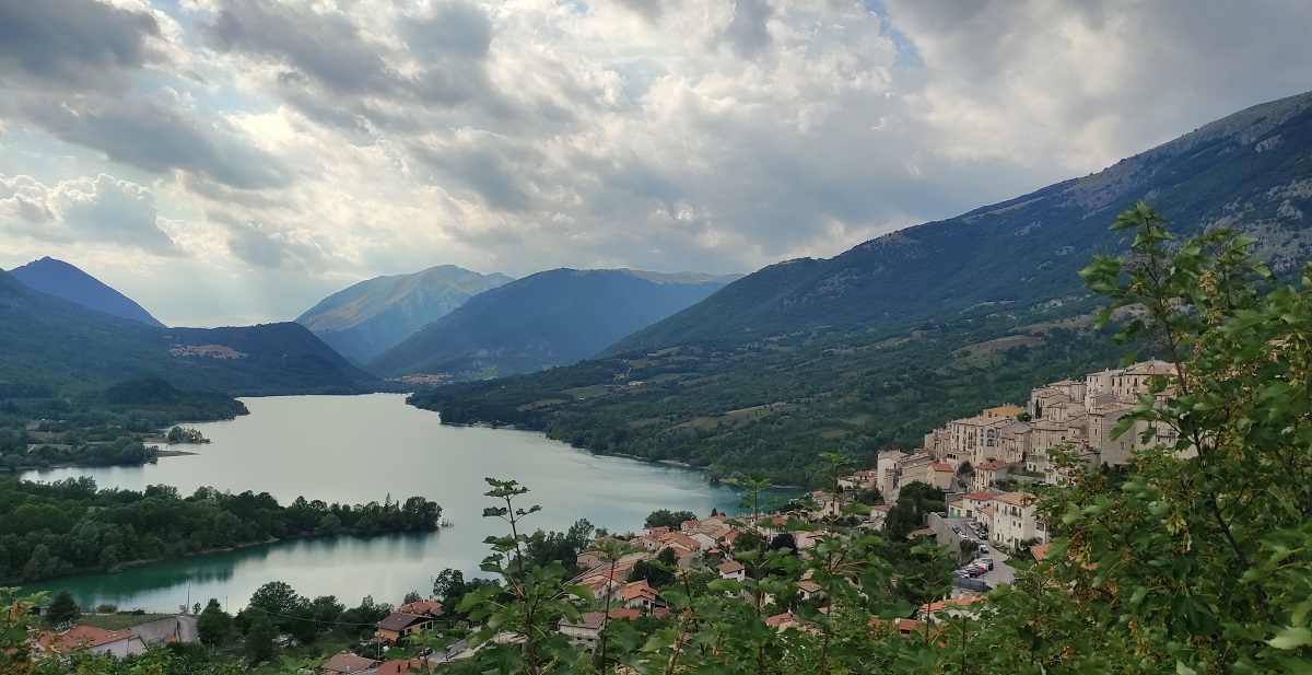 View of lake and mountains with village of Villetta Barrea in foreground