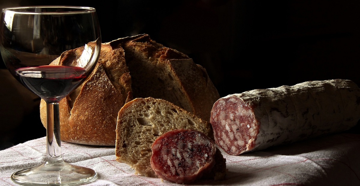 Salame, bread and wine on a table