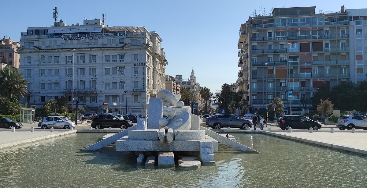 Sculpture Fontana La Nave with city beyond.
