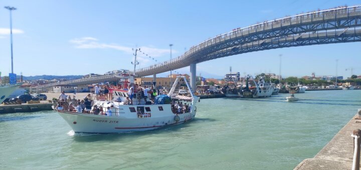 Boat carrying statue of Sant'Andrea passing under the Ponte del Mare, Pescara