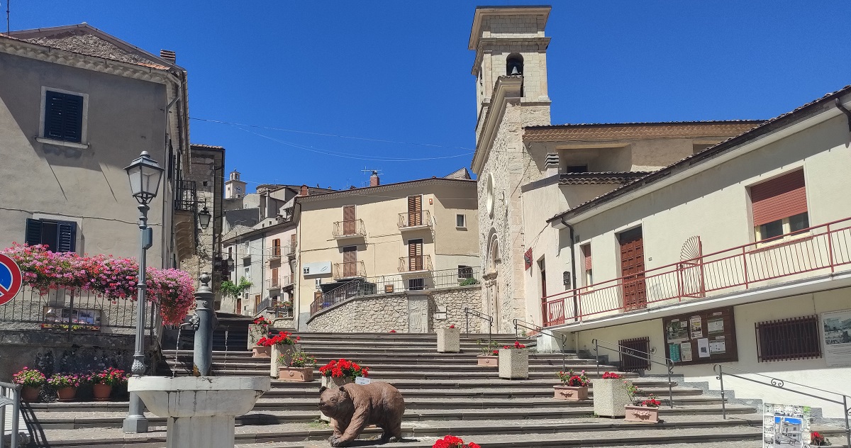 Main steps with fountain and bear statue in foreground, Church of the Madonna di Loreto on the right.