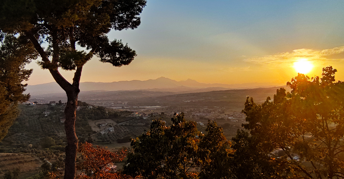 Sunset over valley and mountains in distance, from Montesilvano Paese