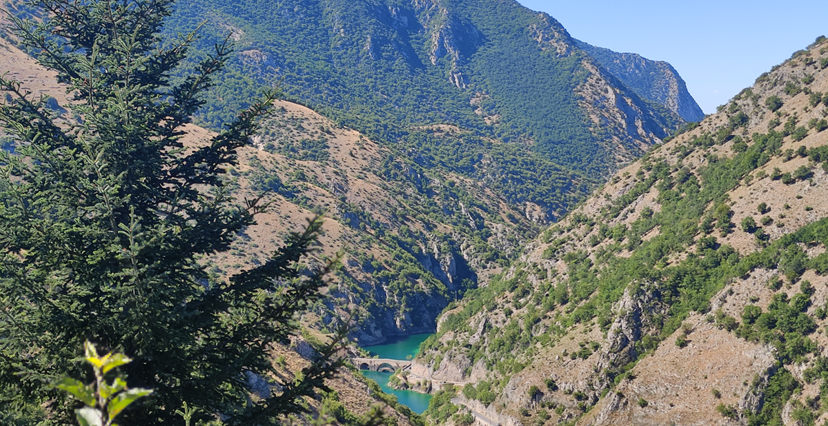 Gole di Sagittaria, with river and bridge visible in foreground.